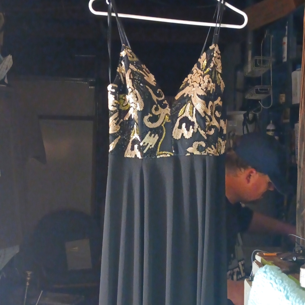 Long 60 inches from top of the back to the very bottom of dress, very low cut fr